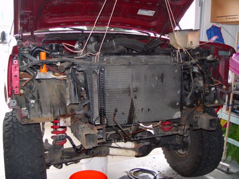 1994 Ford Bronco - Out with the old. To keep fome having to drain the coolant and discharge the a/c. I suspended the radiators from the cieling, and carefully…