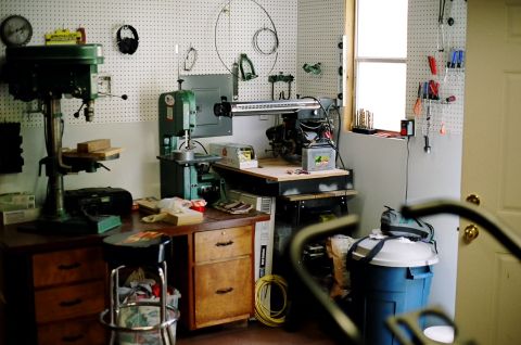 1976 Ford F-150 - A workshop scene filled with various tools and machinery, including a drill press and band saw.