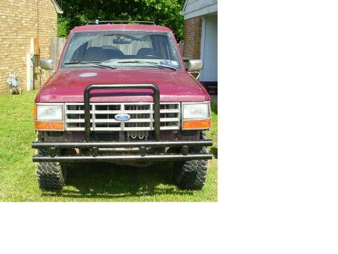 1989 Ford Bronco II - This red 1989 Ford Bronco II is shown from the front, equipped with a black bull bar.