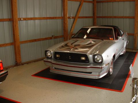 1978 Ford Mustang II - This car has a distinctive hood decal and red trim accents on its front bumper and side skirts.