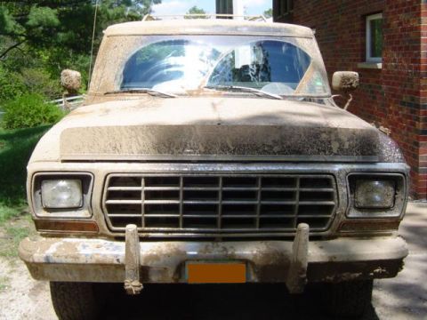 1979 Ford Bronco - This 1979 Ford Bronco is heavily coated in mud, obscuring most of its details.