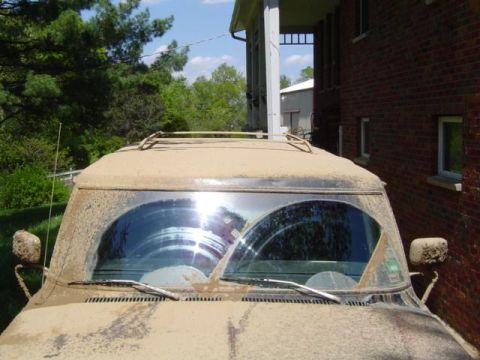 1979 Ford Bronco - This 1979 Ford Bronco is heavily covered in mud, obscuring much of its detail but still recognizable.
