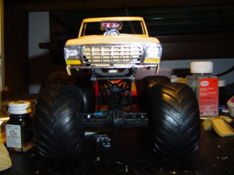 1979 Ford Bronco - Model monster truck with a 1979 Ford Bronco grille and large tires.
