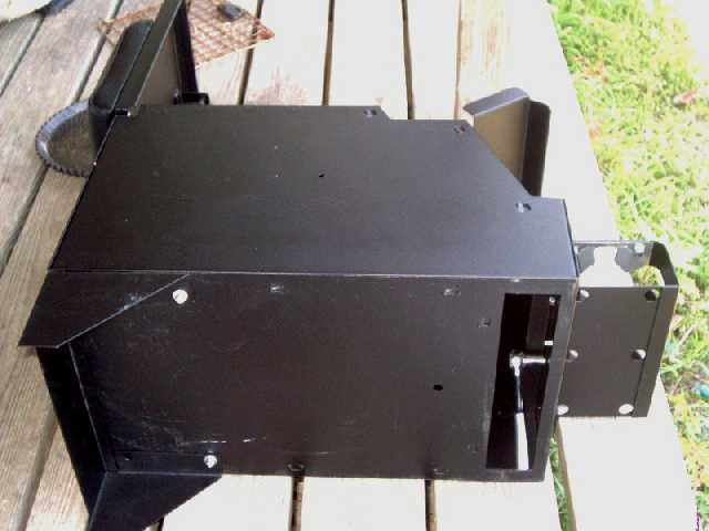 The bottom of the console has an opening to access the 2 bolts for the cup holder.