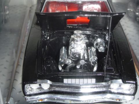 1979 Ford Bronco - This is a model car with its hood open, revealing a detailed engine bay with chrome components.