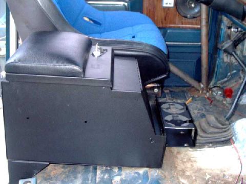 1984 Ford Bronco - OOPS!!! The cup holder interferes with the transfer case shift lever. Remove and bolt it to the rear of the console instead.