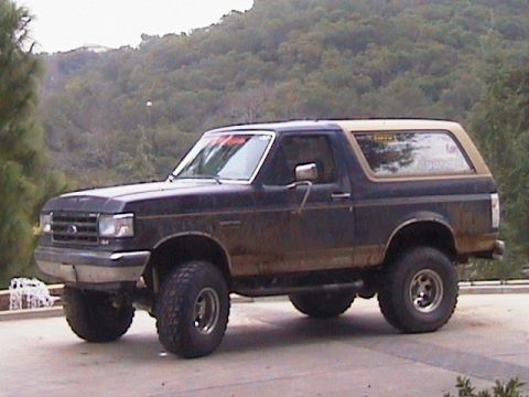 1991 Ford Bronco - This 1991 Ford Bronco features a two-tone paint scheme and an elevated suspension system.