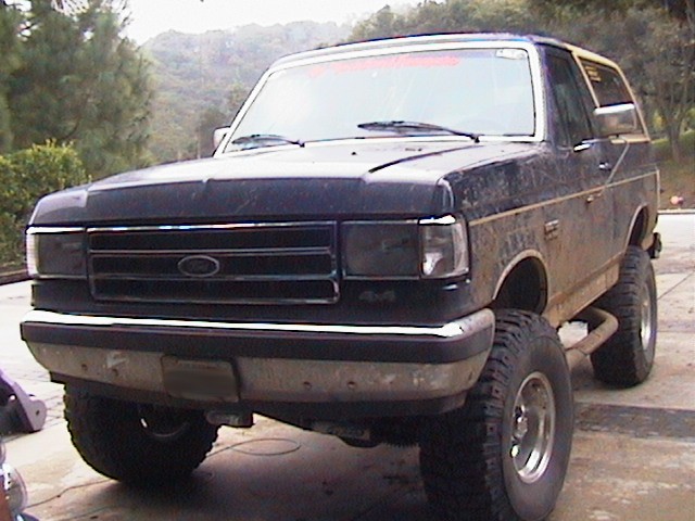 Black Ford Bronco with lifted suspension and off-road tires