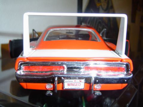 1979 Ford Bronco - A model car with a distinctive rear wing and chrome bumper is viewed from the back.