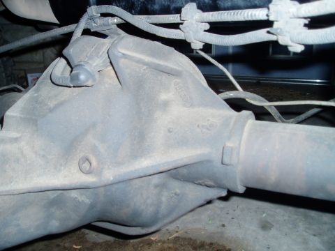1990 Ford Bronco - Close-up view of a vehicle's rear differential housing and associated components.