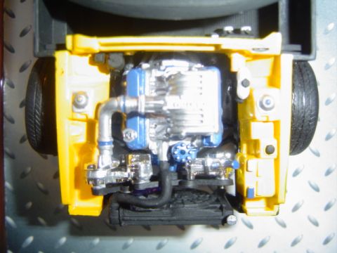 1979 Ford Bronco - Close-up view of a model engine bay, showing intricate details of the engine and surrounding chassis.