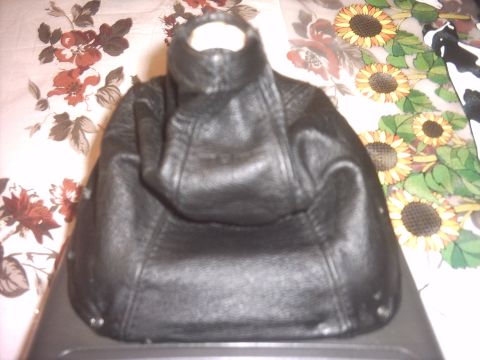 1989 Mazda MX-6 - This is a black leather shift boot, likely for a manual transmission vehicle. The registry claims it is from a 1989 Mazda MX-6, but this ca…