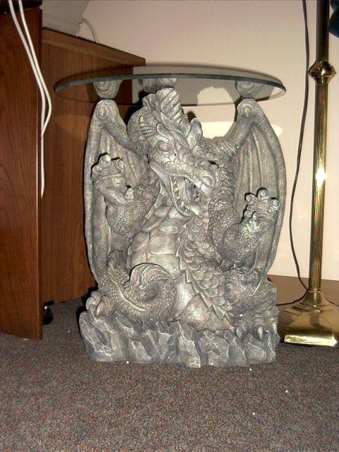 1976 Ford F-150 - A decorative table features a dragon statue base supporting a glass top, with a floor lamp visible to the right.