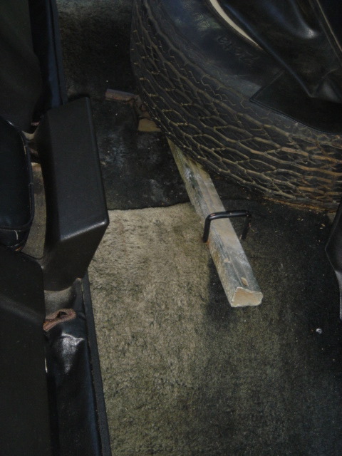 1975 Ford Ranchero - Spare tire and jack are visible in the cargo area of the vehicle.