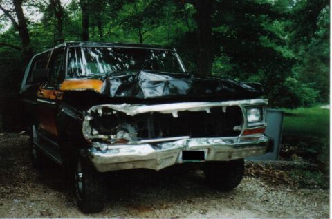 1979 Ford Bronco - This Ford Bronco has significant front-end damage, including a crumpled hood and missing grille.