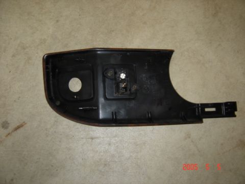 1990 Ford Bronco - Interior trim part with electrical connector, likely from a vehicle.
