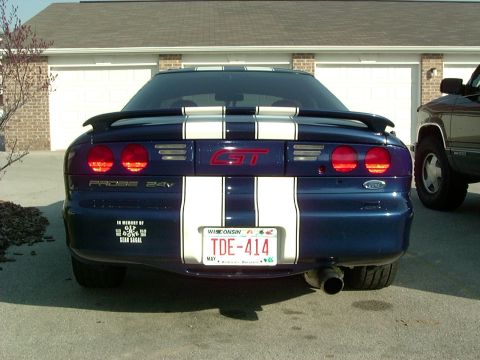 1995 Ford Probe - Rear view of a blue 1995 Ford Probe GT white racing stripes and a spoiler.