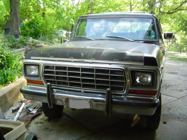 1979 Ford Bronco front view, dark paint, chrome grille, chrome bumper