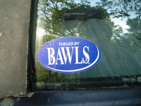 1979 Ford Bronco - A blue oval sticker with white text is affixed to the interior of a vehicle's window.