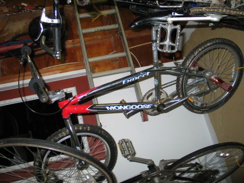 1995 Ford Bronco - BMX bike with 'Mongoose' and 'Expert' labels, another bicycle is visible below.