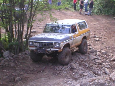 1978 Ford Bronco - 1978 Ford Bronco navigating a challenging rocky off-road course.