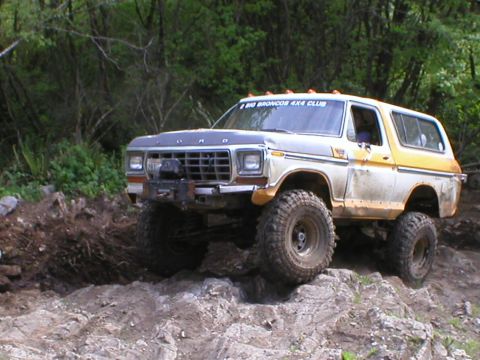 1978 Ford Bronco - A lifted 1978 Ford Bronco navigates a challenging rocky trail.