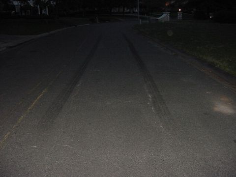 2000 Chevrolet Tahoe - Tire tracks are visible on the road, suggesting recent vehicle activity.