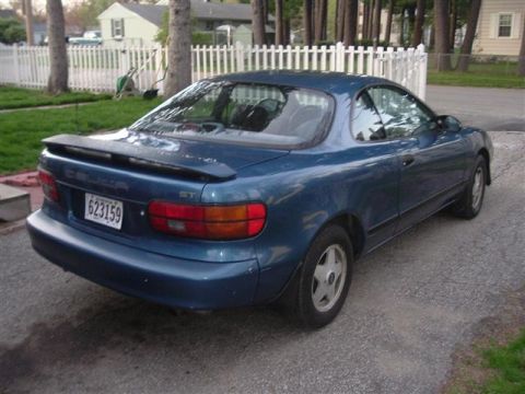 1990 Toyota Celica - Rear view of a blue 1990 Toyota Celica ST coupe parked on a driveway.