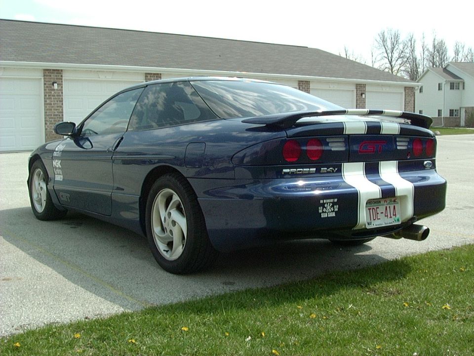 1995 Ford Probe GT, blue with white racing stripes on rear, GT badge visible
