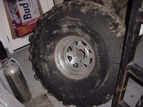 1971 Ford Bronco - This photo shows a large off-road tire and rim, not a 1971 Ford Bronco.