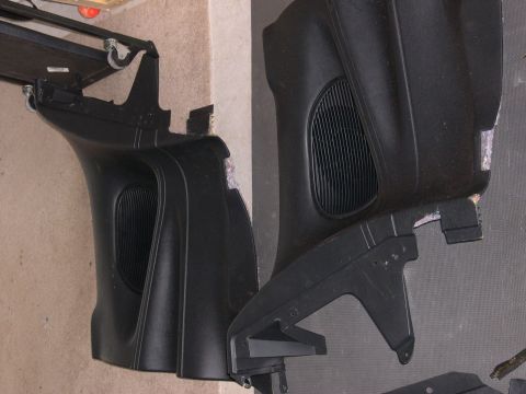 1997 Ford Probe - Two black plastic interior trim pieces, likely from a car's dashboard or door panel, are shown with visible speaker grilles.