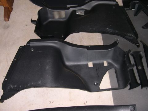 1997 Ford Probe - Several black plastic interior trim pieces are displayed, suggesting they are parts for a vehicle.