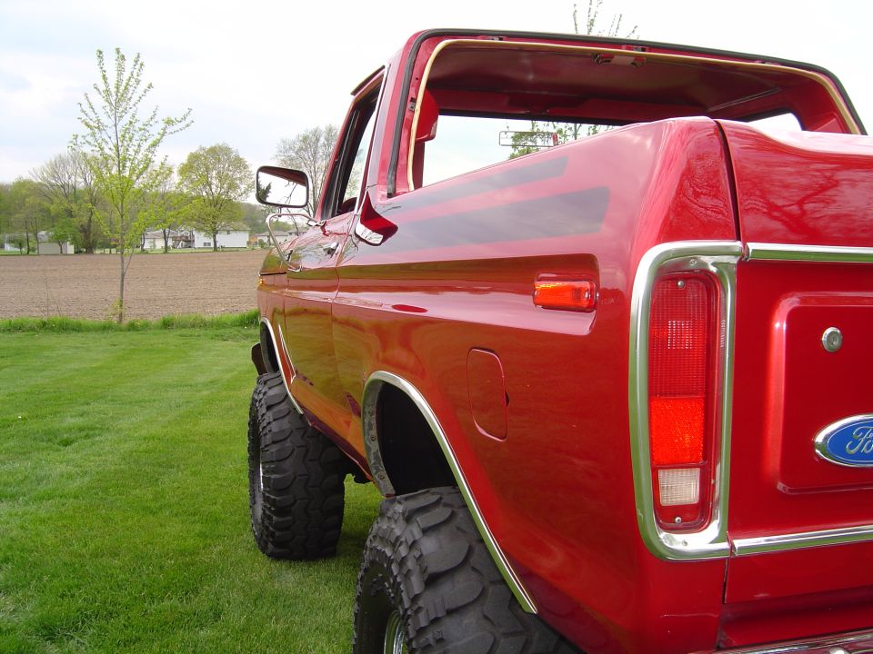 Red 1978 Ford Bronco rear quarter panel and tailgate with chrome trim