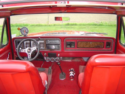 1978 Ford Bronco - The dashboard and seats of a 1978 Ford Bronco are visible in this interior shot.