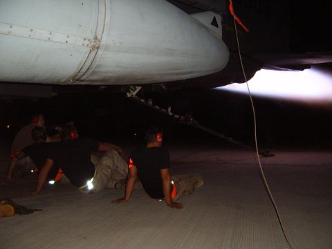 1988 Ford Bronco - Ground crew members observe an aircraft engine during an afterburner run.