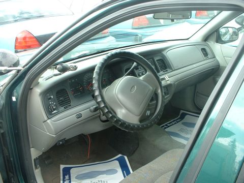 1999 Ford Crown Victoria - Interior view of a 1999 Ford Crown Victoria, with other vehicles visible in the background.