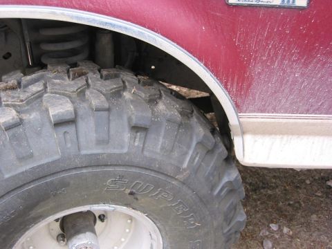 1993 Ford Bronco - Rear of the front fender is darn close.. But once it's flexed it wont make it.