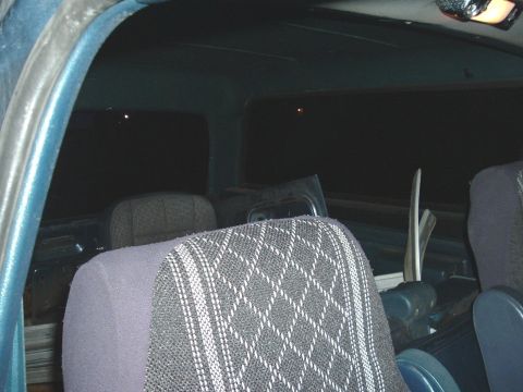 1982 Ford Bronco - The interior of the vehicle shows patterned seats and dark, reflective windows.