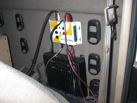 1997 Dodge 1500 - This is my Legacy crossover on top and my Power Acoustik amps for my high. They are mounted on the back wall of the cab.