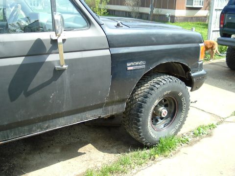 1989 Ford Bronco - The 'BRONCO' badge is visible on the fender of this 1989 Ford Bronco, seen from a 3/4 front angle.