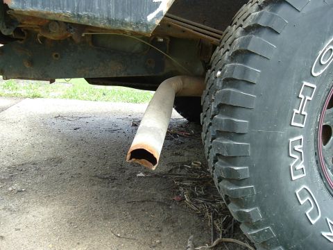 1989 Ford Bronco - Bent tailpipe happened while wheeling. Yanked it off and ran over it while backing up. Had to use a hose clamp to hold in place.