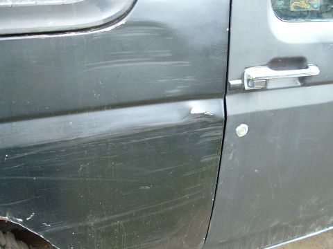 1989 Ford Bronco - This dent caused while going between 2 trees that were to close together, old door was greatly damaged. Was replaced.