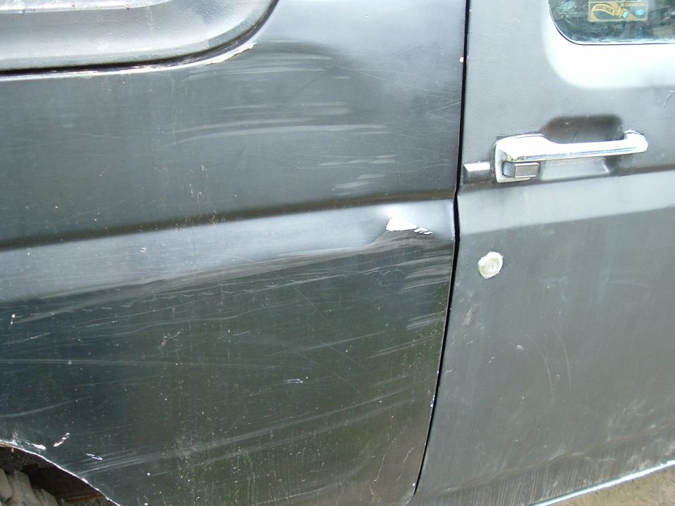 This dent caused while going between 2 trees that were to close together, old door was greatly damaged. Was replaced.