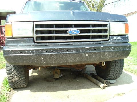 1989 Ford Bronco - Front view of a 1989 Ford Bronco, showing the grille, headlights, and bumper.
