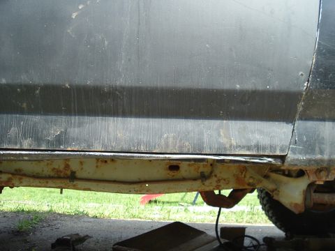 1989 Ford Bronco - Bent rocker panel, sat on a stump...had to be winched off. Not as bad as it was before, had to bend it out so new door could close properly.