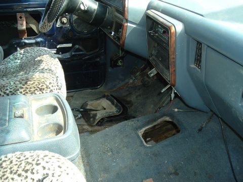 1989 Ford Bronco - Interior view of a 1989 Ford Bronco, showing the dashboard, steering wheel, and worn seats.