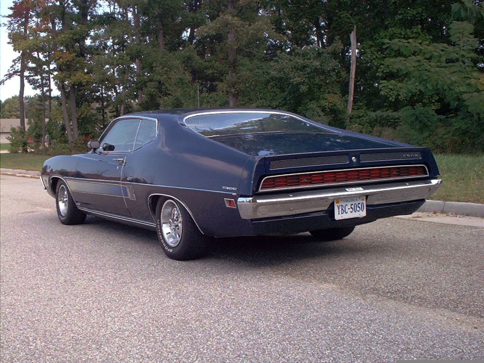 1970 Ford Torino rear view, dark blue coupe with chrome bumper and license plate YBC-5050
