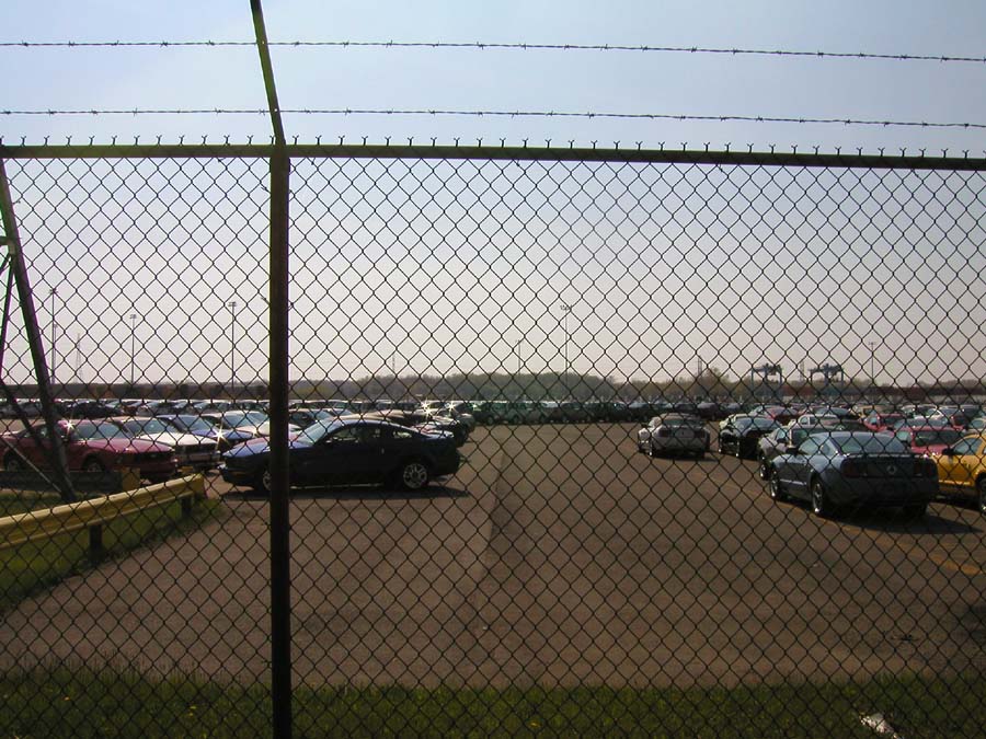 2005 Ford Mustang and other cars in a large outdoor lot