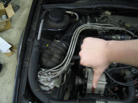 1987 Volkswagen Golf - Hand giving a thumbs down in a car's engine bay, with "SUPERMOTORS" logo visible.