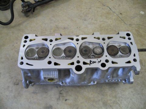 1987 Volkswagen Golf - A close-up view of an engine cylinder head, with the name 'Kevin' scrawled on its surface.